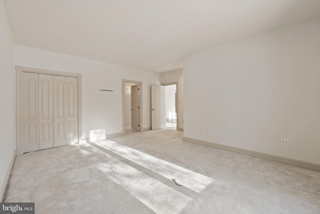 interior space featuring light colored carpet