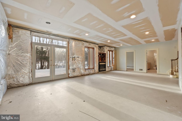 unfurnished living room with french doors