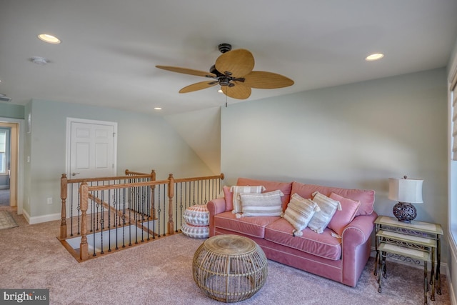 living room featuring vaulted ceiling, ceiling fan, and carpet floors