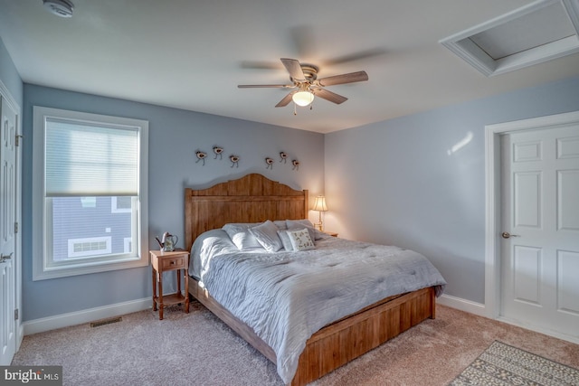 bedroom with ceiling fan and light colored carpet