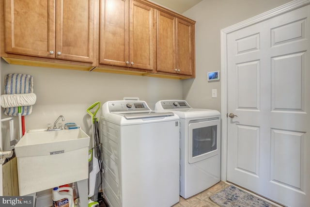 laundry room with cabinets, separate washer and dryer, light tile patterned flooring, and sink