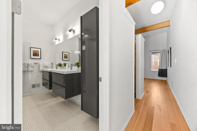 bathroom with wood-type flooring and vanity