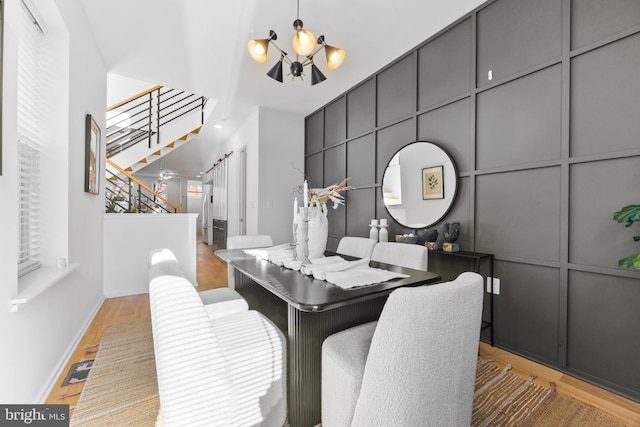 dining room featuring an inviting chandelier and light hardwood / wood-style floors