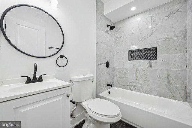 full bathroom with vanity, toilet, and tiled shower / bath