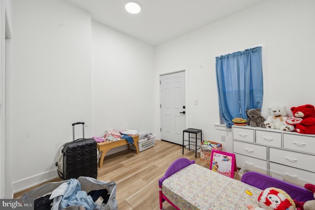 bedroom with light hardwood / wood-style flooring