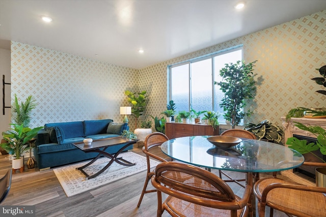 dining space with light hardwood / wood-style flooring