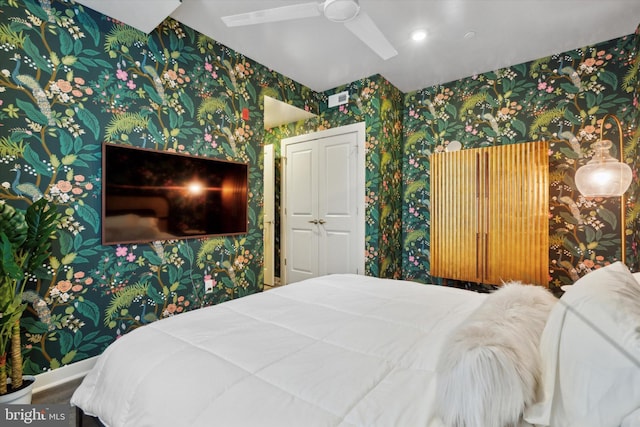 bedroom featuring ceiling fan and hardwood / wood-style floors