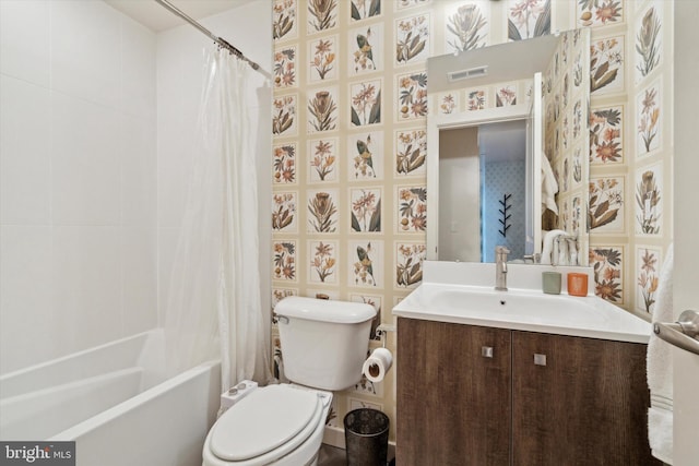 full bathroom with vanity, shower / tub combo, and toilet