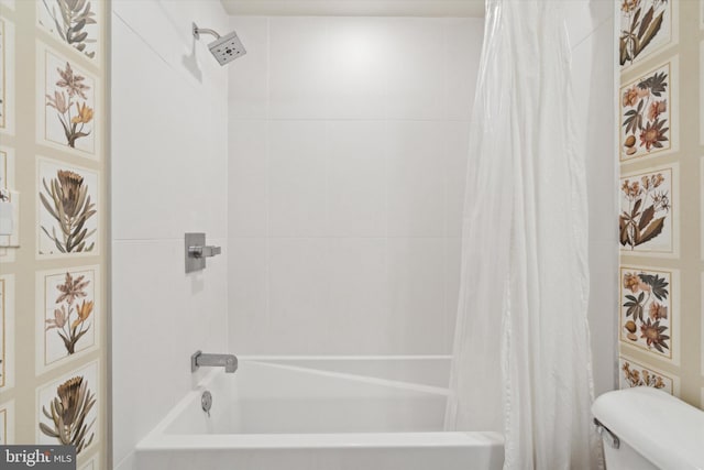 bathroom with shower / bath combo and toilet