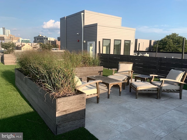 view of patio / terrace featuring fence