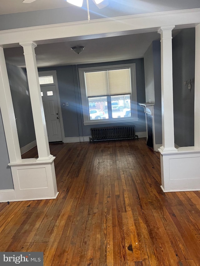 interior space featuring dark hardwood / wood-style flooring and radiator