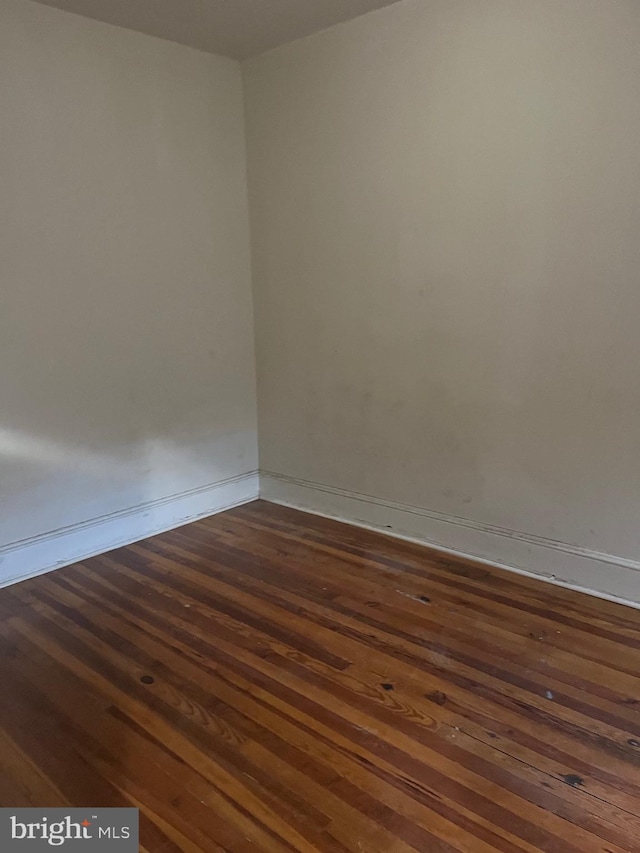 empty room featuring dark hardwood / wood-style floors