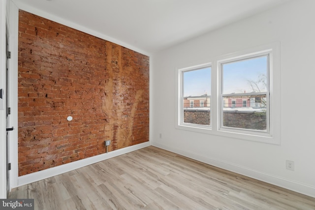 spare room with light wood-type flooring