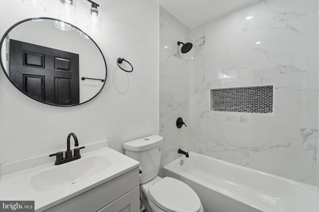 full bathroom featuring toilet, vanity, and tiled shower / bath