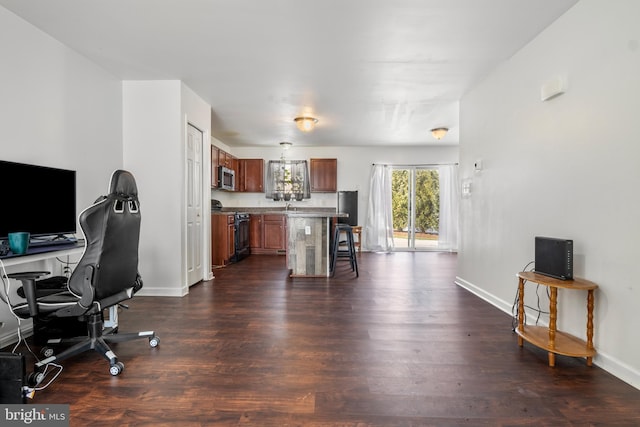 office space with dark hardwood / wood-style flooring