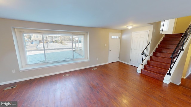 entrance foyer featuring dark wood-type flooring