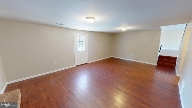 unfurnished room featuring dark hardwood / wood-style floors