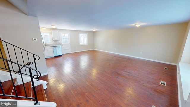 unfurnished living room with hardwood / wood-style flooring