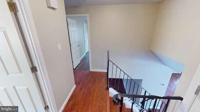 staircase featuring hardwood / wood-style floors