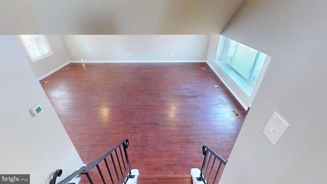 spare room featuring dark hardwood / wood-style flooring