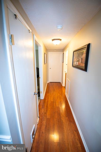 hallway featuring hardwood / wood-style floors