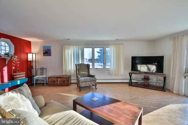 living room with hardwood / wood-style flooring and a baseboard radiator