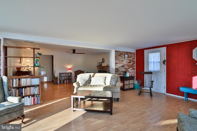 living room with hardwood / wood-style flooring and a fireplace