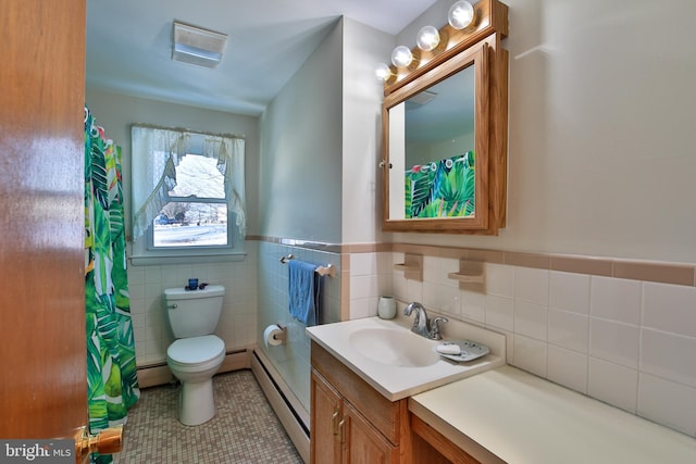 bathroom with vanity, tile patterned floors, baseboard heating, and toilet