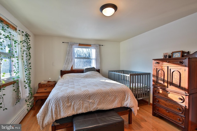 bedroom with light wood-type flooring