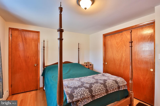 bedroom featuring a closet and light hardwood / wood-style flooring