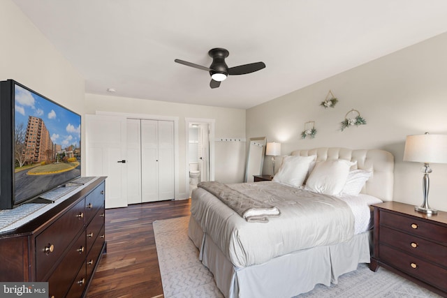 bedroom featuring hardwood / wood-style floors, a closet, ceiling fan, and ensuite bathroom