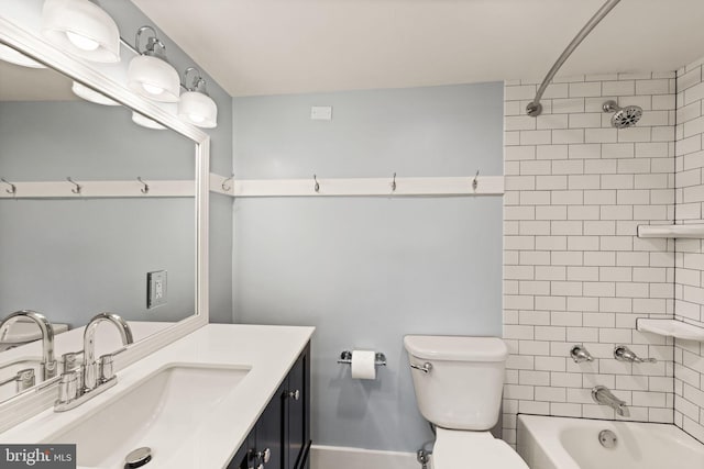 full bathroom featuring vanity, toilet, and tiled shower / bath