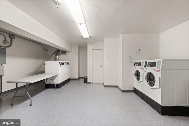 washroom featuring washing machine and dryer