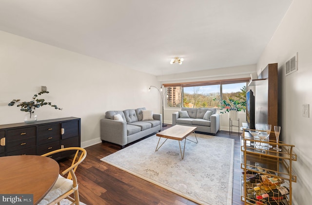 living room featuring dark hardwood / wood-style flooring