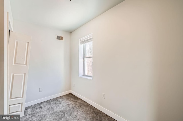 222 S Carey St, Baltimore, MD 21223 - carpeted spare room featuring baseboards