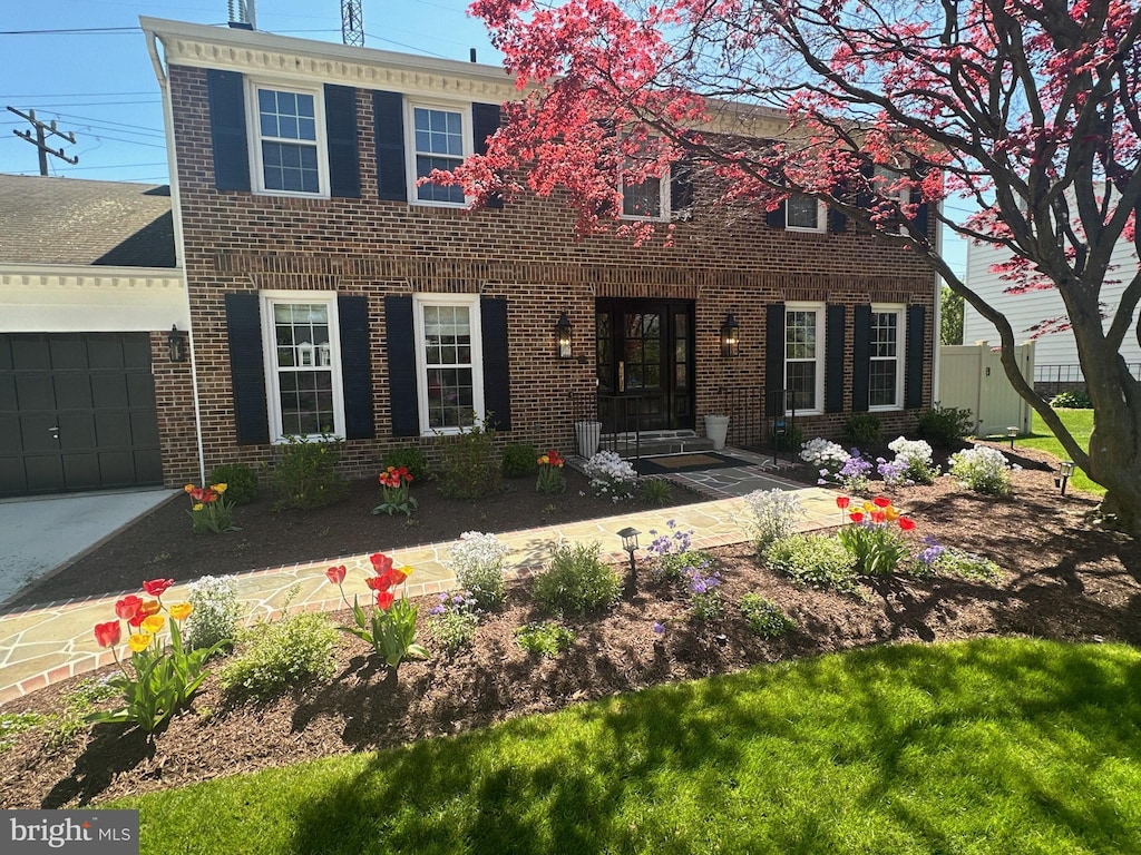 colonial house featuring a garage