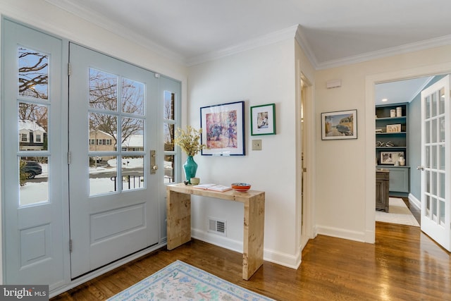 doorway featuring french doors, crown molding, and dark hardwood / wood-style floors