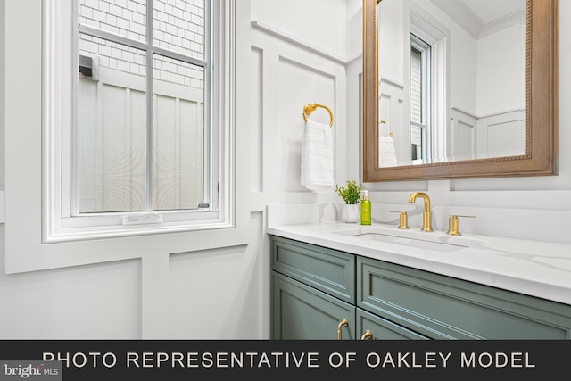 bathroom with vanity and crown molding