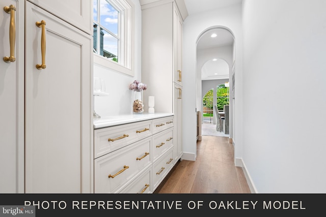 corridor featuring light hardwood / wood-style floors