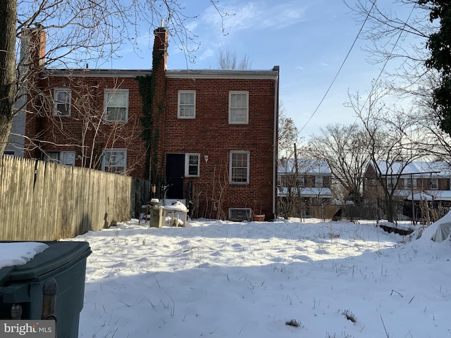 view of snow covered house