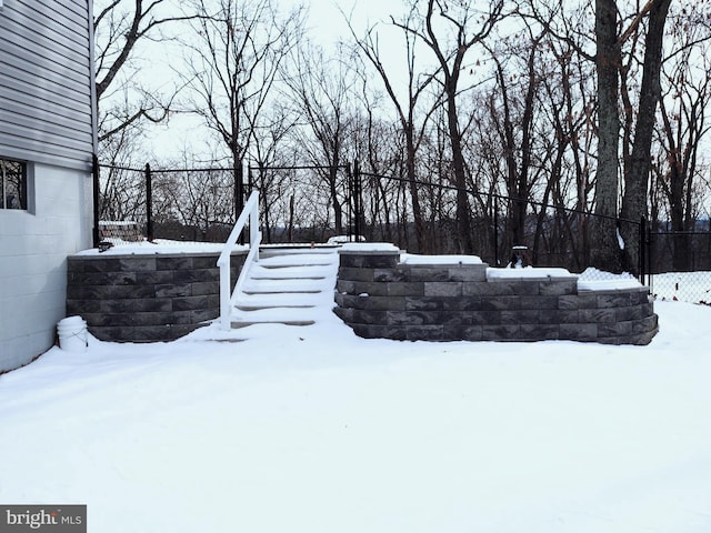 view of yard layered in snow