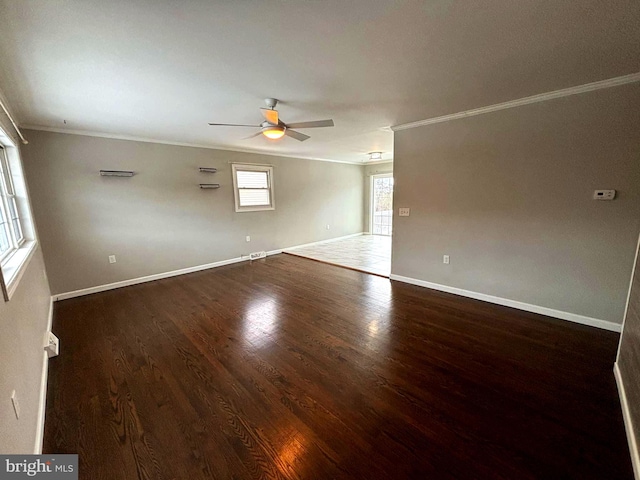 unfurnished room with ceiling fan, crown molding, and dark wood-type flooring