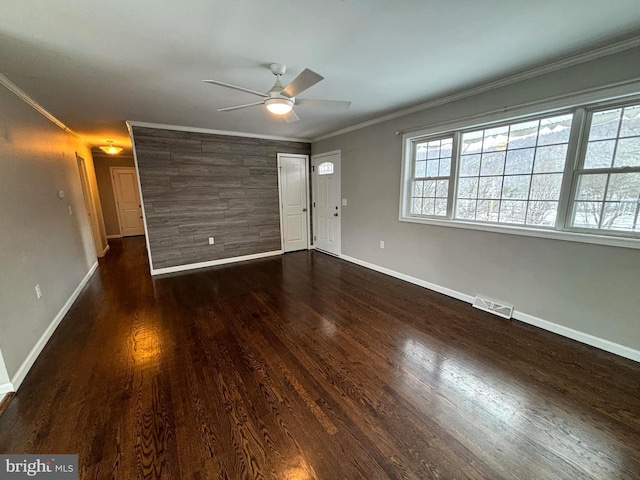 interior space featuring dark hardwood / wood-style floors, ceiling fan, and ornamental molding