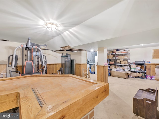 interior space featuring pool table and wooden walls