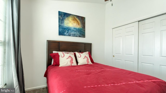 carpeted bedroom featuring a closet