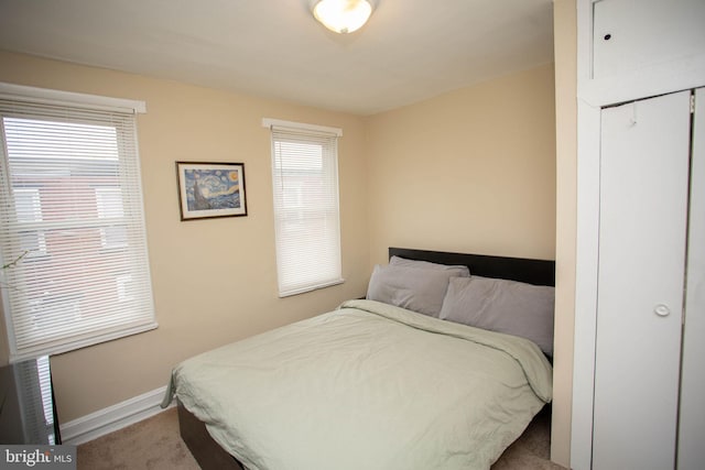 bedroom featuring carpet