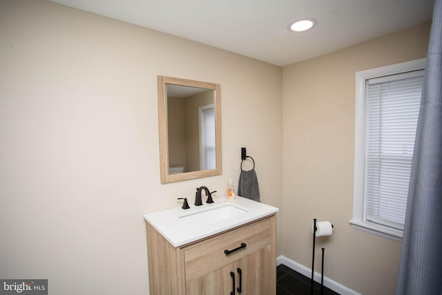 bathroom with tile patterned flooring and vanity