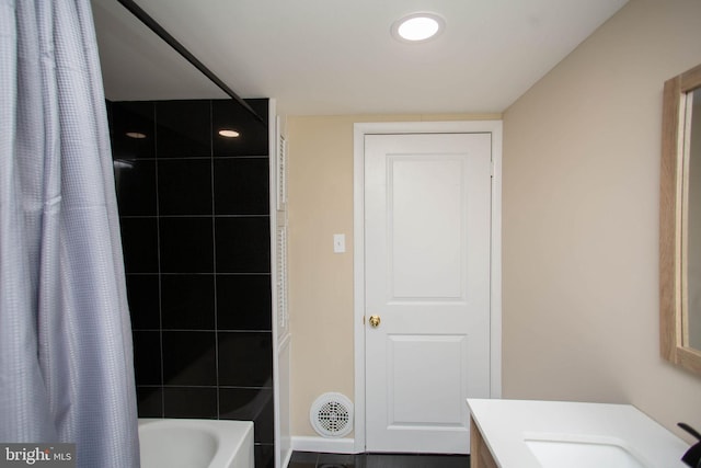 bathroom with vanity and shower / bathtub combination with curtain