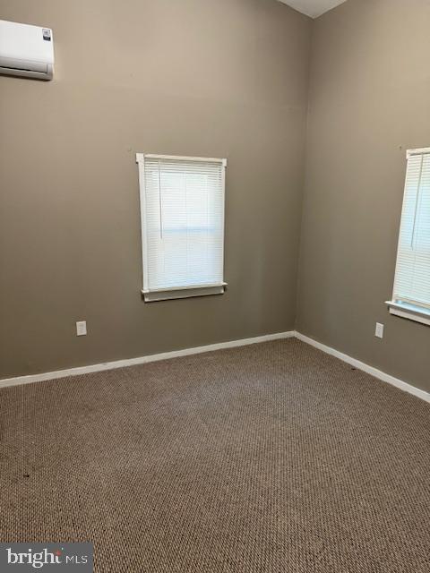 140 Jones Way, Browns Mills, NJ 08015 - unfurnished room with carpet, plenty of natural light, and a wall mounted AC
