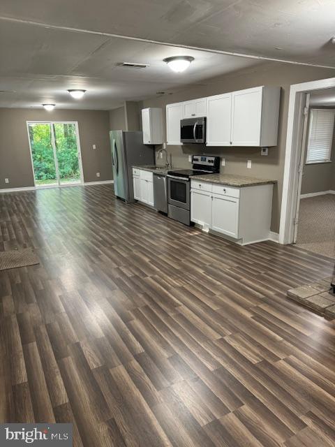 140 Jones Way, Browns Mills, NJ 08015 - kitchen with white cabinetry, dark hardwood / wood-style flooring, stainless steel appliances, and sink